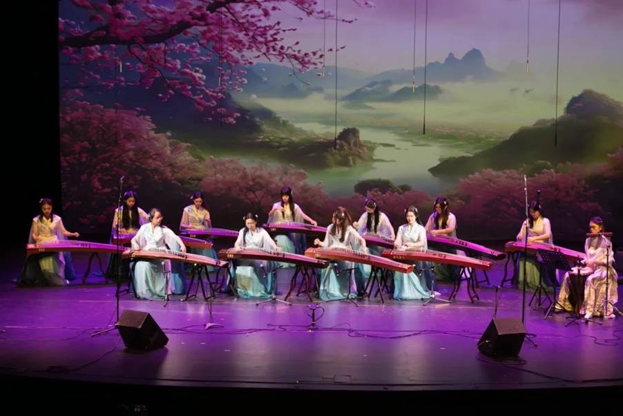 YCMA musicians performing together in a guzheng ensemble